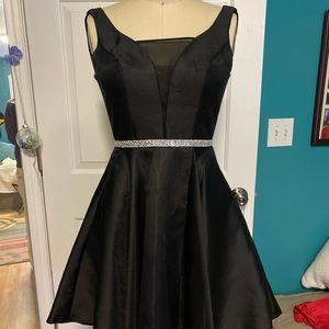 Short Black cocktail dress with flared skirt
